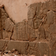 An ancient relief lies shattered in the Northwest Palace at the nearly 3,000-year-old site of Nimrud, Iraq. Photo via AP Images.